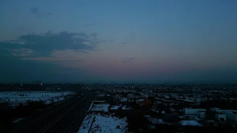 At sunset, a drone flying with crows over the road 動画素材 294822792