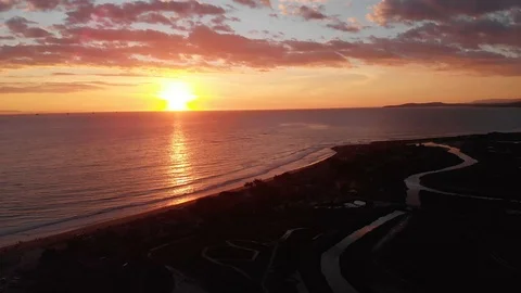 Sunset Drone Moving Over Marsh with Vibrant Colors 库存影片 100664260
