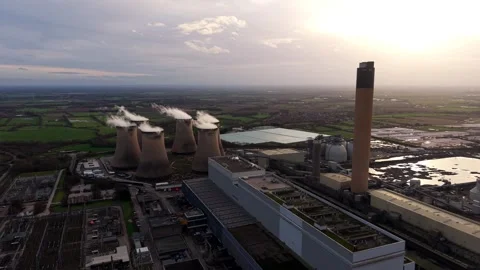 Sunset drone overview of a major green energy facility and heavy utility grid Stock Footage 339047406