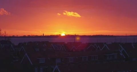 Sunset drone panning shot in marken with old dutch houses in front Video stock 70895115