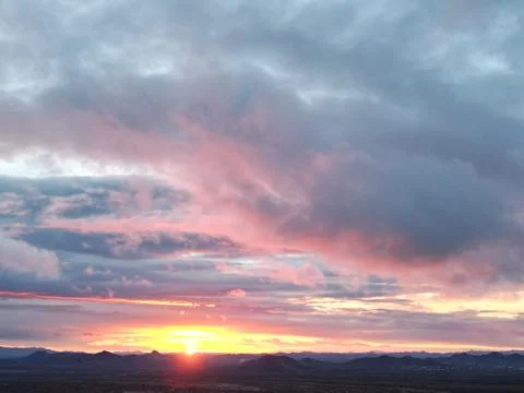 Sunset Drone Photo with Layered Cloud Color Over Arizona Desert Stock Photos
