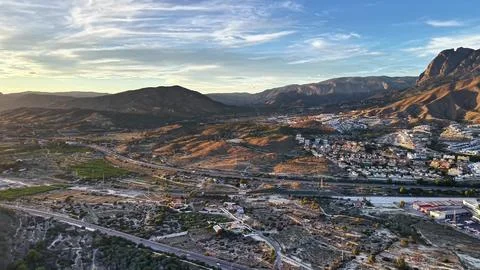 Sunset Drone Scans Rugged Landscape, Drone Captures Valley Scene During Sunset Stock-Fotos