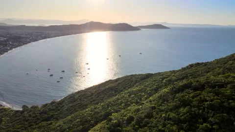 Sunset drone scene seen from above with paradisiacal beach and mountains Stock Footage 228216527