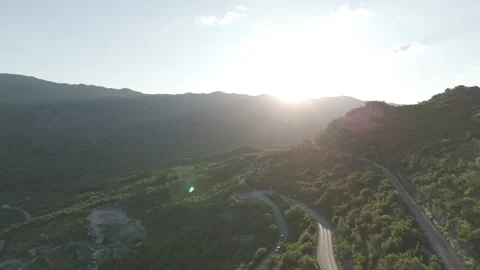 Sunset Drone Shot Over Mountain Road and Railway Near Ostrog, Montenegro Stock-Footage 310335491