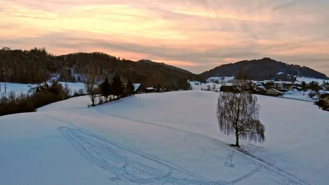 Sunset Drone shot over winter landscape with final heart in the snow Stock Footage 130071587