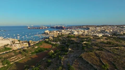 Sunset drone view of Birzebbuga city. Port, boats, marina. Malta island Stock Footage 278886875