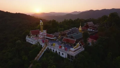 Sunset Drone View of Buddhist Temple and Majestic Mountains in Thailand Stock Footage 299670553