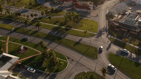 Sunset Drone View of Casa Bahamas, Highway and Roundabout in Freeport Stock Footage 89446364
