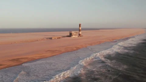 Sunset Drone View of Lighthouse at Pelican Point in Walvis Bay, Namibia, Africa Stock Footage 246914817