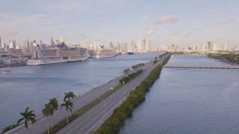 Sunset Drone View of Miami Port, Luxury Ships, and Causeway Traffic Stock Footage 315290632