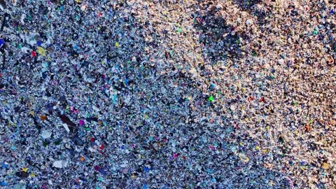 Sunset drone view over Livberze landfill waste textures with slow backward glide Video stock 328920799