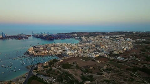 Sunset drone view of port and Birzebbuga city. Boats, marina. Malta island Stock Footage 278892760