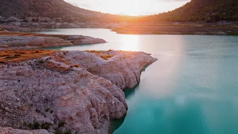 Sunset Drone View of Rocky Lake Shore in Spain Stock Footage 314606422