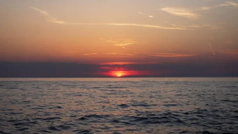 Sunset Dropping Into the Sea With Gentle Waves Stock Footage 341668527