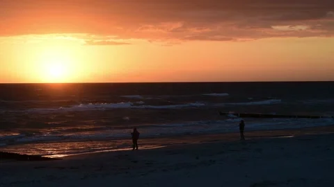 Sunset during waves rinse to the beach on the german island HIDDENSEE on the Video stock 142213678
