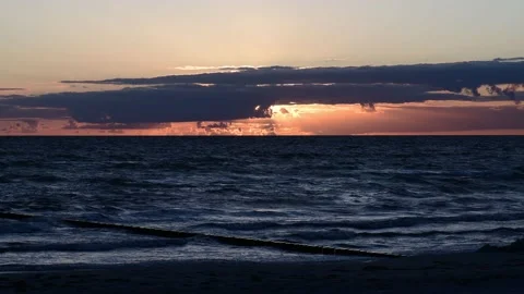 Sunset during waves rinse to the beach on the german island HIDDENSEE on the Video stock 142215657