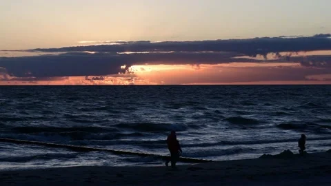 Sunset during waves rinse to the beach on the german island HIDDENSEE on the Video stock 142589910