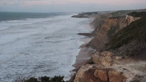 Sunset at dusk on the Atlantic Ocean, beautiful sky and waves in Portugal Stock Footage 259826829