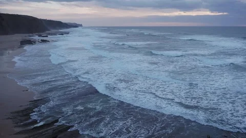 Sunset at dusk on the Atlantic Ocean, beautiful sky and waves in Portugal Stock Footage 259826863