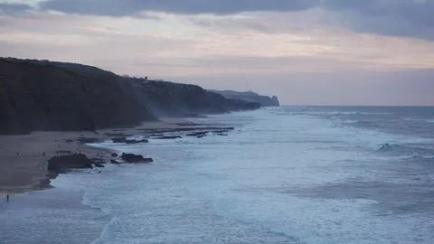 Sunset at dusk on the Atlantic Ocean, beautiful sky and waves in Portugal Stock Footage 259826876