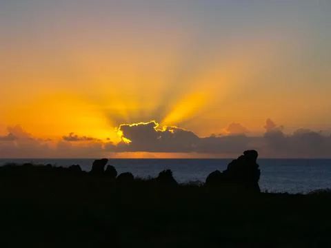 Sunset on Easter Island. The colors of sunset in ocean. Stock Photos