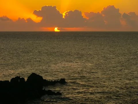 Sunset on Easter Island. The colors of sunset in ocean. Stock Photos