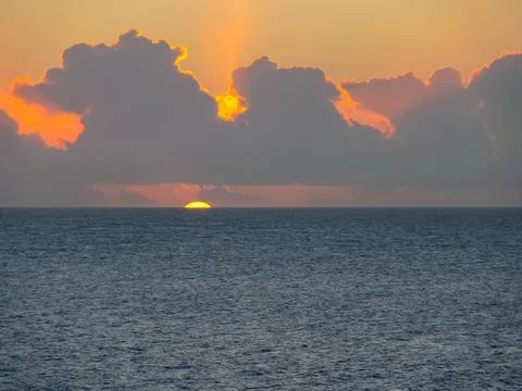 Sunset on Easter Island. The colors of sunset in ocean. Stock Photos