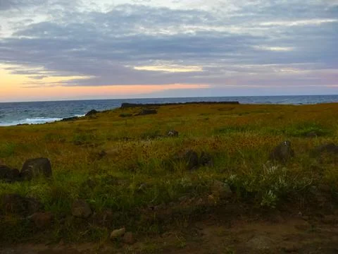 Sunset on Easter Island. The colors of sunset in ocean. Stock Photos
