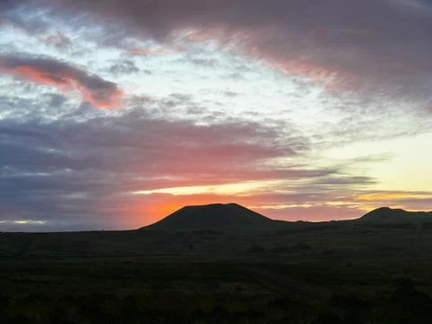 Sunset on Easter Island. The colors of sunset in ocean. Stock Photos