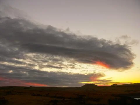 Sunset on Easter Island. The colors of sunset in ocean. Stock Photos