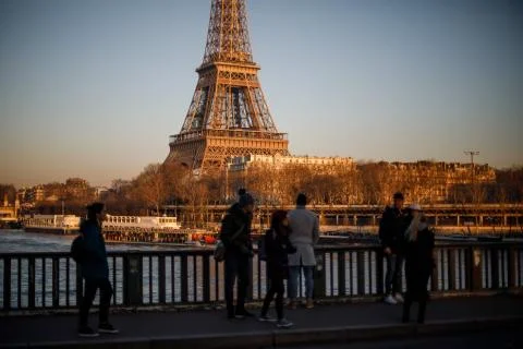 Sunset on the Eiffel Tower, seen from Pont de Bir Hakeim in Paris Stock Photos