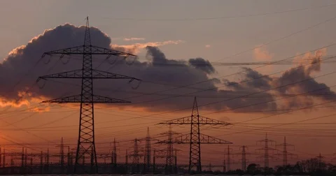 Sunset with electrical towers, Utility poles Stock Footage 78571014