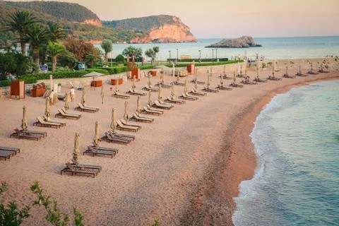 Sunset on empty beach with clean water Stock Photos