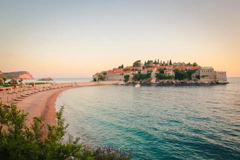 Sunset on empty beach with view on old town island Stock Photos