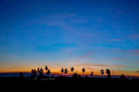 Sunset the evening light through the clouds and  trees. Stock Photos