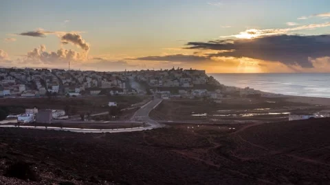 Sunset evening sky over Sidi Ifni town in Morocco ocean coast Time lapse Stock Footage 234189306