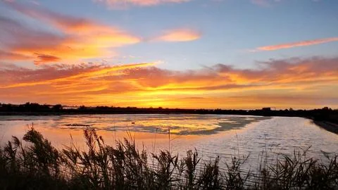 Sunset in fall over the Po River Delta Stock Photos