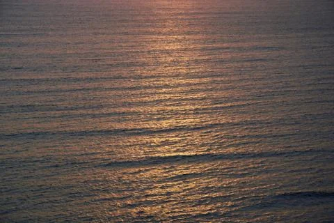 Sunset is falling on the big ocean Stock Photos