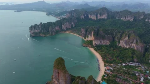 Sunset falls over Railay Beach and lush cliffs in Ao Nang Stock Footage 307437446