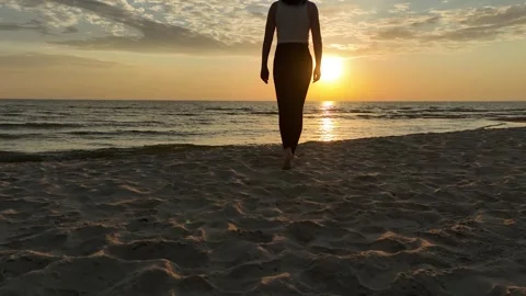 Sunset - female on the beach Stock Footage 241661000