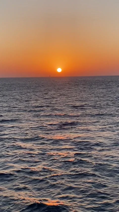 Sunset Ferry crossing from Gozo to Malta with distant sailing boat silhouette Stock Footage 310669671