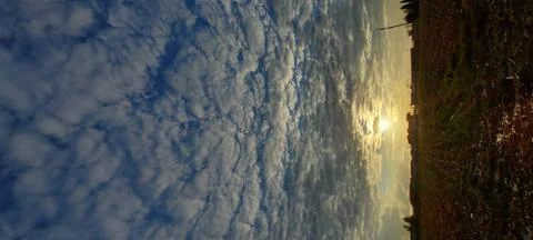 A sunset in a field, cloudscape Stock Photos