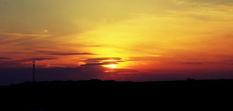 Sunset in the field Fotos Stock