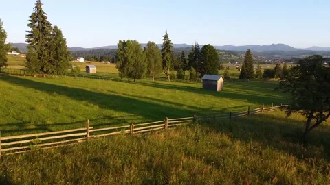 Sunset on a Field With Tree And Warehouse Video stock 156764502