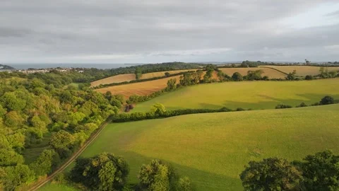 Sunset of Fields and Farms over Devon from a drone, Torquay, Torbay, Devon, UK Vidéo 314988770