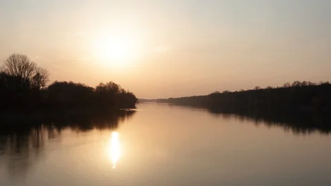 Sunset filmed with drone at the river. Slow forwarding drone filmed in 4k Stock Footage 127537037