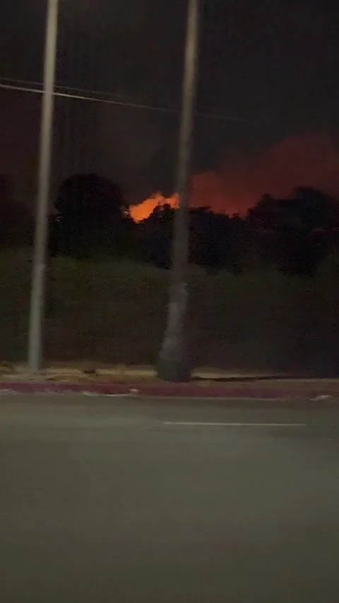 Sunset Fire from Sunset Blvd – Runyon Canyon Fire -2025 | Traffic View Stock Footage 300710284