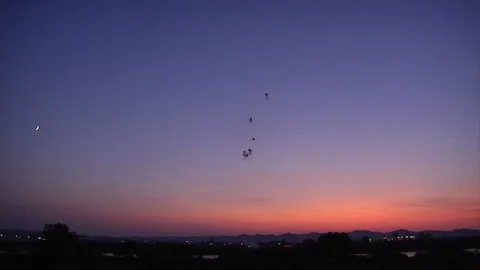 Sunset, Fireworks, and the Crescent Moon Stock Footage 327610500