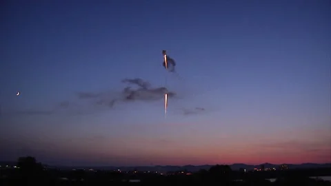 Sunset, Fireworks, and the Crescent Moon Video stock 327610523
