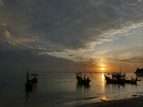 The sunset with fishing ship Stock Footage 76764538